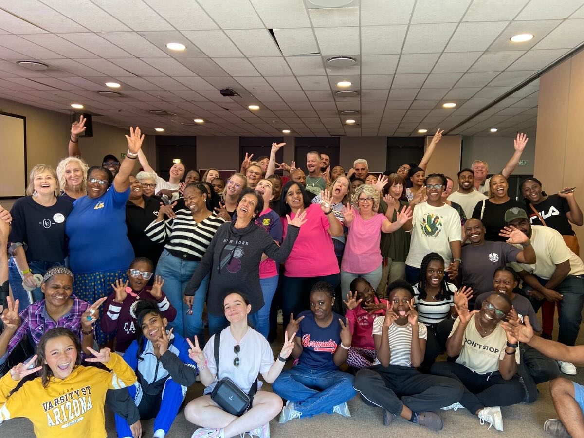 A large group of Liberty Compassion volunteers and community members together